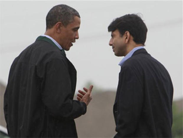 President Barack Obama is greeted by Louisiana Gov. Bobby Jindal, right, as he arrives at Louis Armstrong International New Orleans Airport en route to the Gulf Coast region where he will visit damage caused by the BP oil well spill, Sunday, May 2, 2010. 