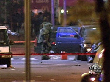 A police bomb squad unit removes incendiary materials from a Nissan Pathfinder parked in New York's Times Square Saturday, May 1, 2010.  