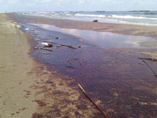 The beach at Grand Isle Beach, La., covered in oil, Friday, May 21, 2010. 