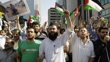 Pro-Palestinian Turks shout slogans during a protest against Israel near the Israeli Consulate in Istanbul, Turkey, Monday, May 31, 2010.  