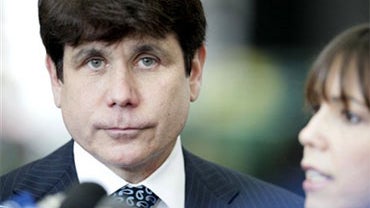 Former Illinois Gov. Rod Blagojevich, listens as his wife Patti makes a statement upon their arrival at the Federal Court building Thursday, June 3, 2010 in Chicago, for jury selection in his federal corruption trial. (AP Photo/M. Spencer Green) 