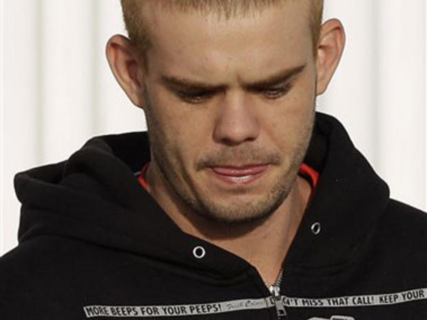 Joran Van der Sloot looks down before boarding an airplane to be flown back to the Peruvian border in Santiago, Chile, Friday, June 4, 2010. 