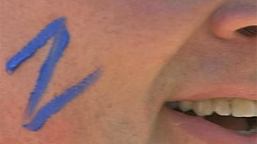 A Z adorns the cheek of a Zappos employee. 