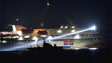 In this image reviewed by the Israeli military, showing the view from aboard an Israeli Naval vessel, as Israeli Navy soldiers intercept several boats headed towards the Gaza Strip, while in international waters in the Mediterranean Sea, early Monday May  