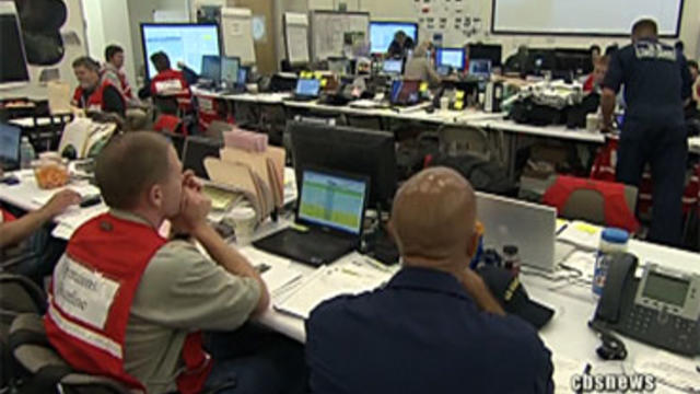 At a joint command center in Houma, La., oil spill response coordinators watch controlled burns of surface oil in the Gulf of Mexico. 