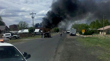 Smoke rises into the air after a small plane crashed into Round Valley High School in Eager, Ariz. on Friday, June 11, 2010. 
