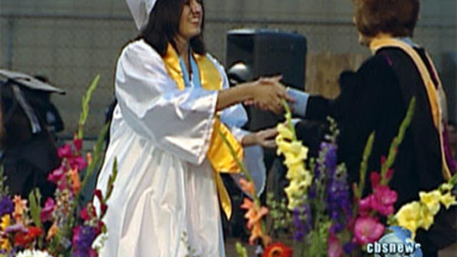 **DOUBLES AS GENERIC GRAD PICTURE** faith herrera accepts her high school diploma 