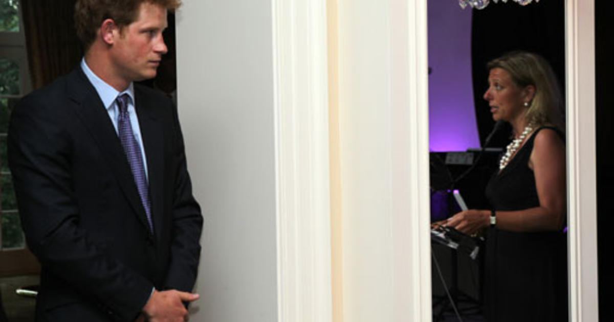 Prince Harry and Rod Barajas pose for photographs at the NY Mets