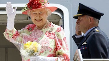 Queen Elizabeth waves goodbye as she boards her plane heading to New York at Pearson International Airport in Toronto Tuesday, July 6, 2010. (AP Photo/Darren Calabrese, The Canadian Press) 