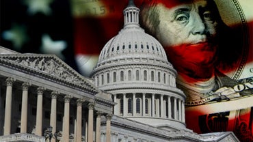 U.S. Capitol Dome over U.S. Flag and 100 dollar bills. 