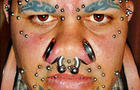 body modification, saline implants, piercings, horns, tattoos 