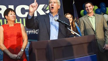 Flanked by his family, Michigan Republican gubernatorial candidate Rick Snyder, center, delivers his victory speech to supporters after the day's primary election, Tuesday, Aug. 3, 2010, in Ypsilanti, Mich. Snyder edged out Michigan Attorney General Mike  