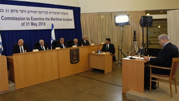 Israel's Prime Minister Benjamin Netanyahu sits before testifying in front of  a state-appointed inquiry commission into the Israeli naval raid on a Gaza aid flotilla, in Jerusalem, Monday, Aug. 9, 2010. 