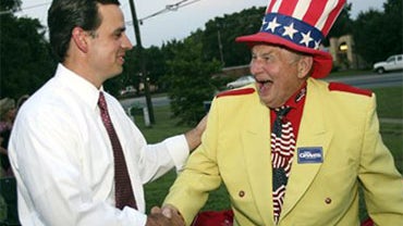 Congressman Tom Graves joins his supporters, including Col. Oscar Poole, at his headquarters in Cumming, Ga. on Tuesday, Aug. 10, 2010. (AP Photo/Jenni Girtman) 