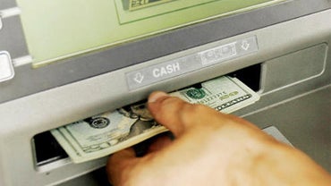 Customer withdraws cash from ATM 