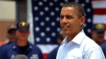 President Barack Obama makes a statement on Gulf Coast recovery following a roundtable discussion with small business owners on the BP oil spill on August 14, 2010 at the US Coast Guard Panama City District Office in Panama City, Florida. Looking on at ri 