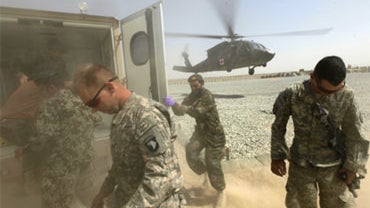 A wounded Afghan soldier and police officer is airlifted away by a medevac helicopter in Kandahar province, Aug. 20, 2010. 