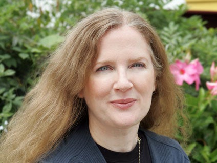 Author Suzanne Collins is shown in New York on Aug. 12, 2009. (AP Photo/Scholastic, Todd Plitt) 
