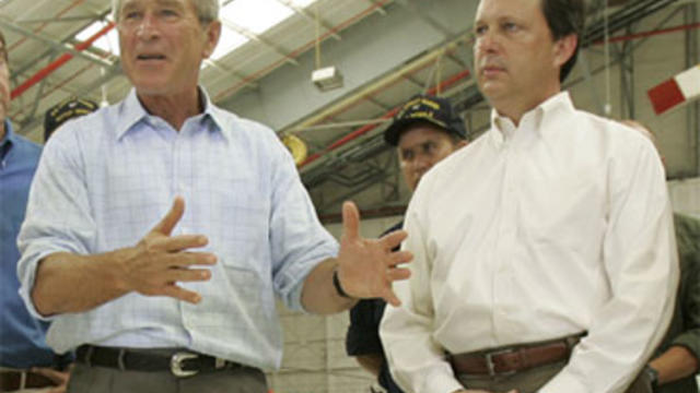 President Bush talks as FEMA director Mike Brown, right, looks on, during a briefing on damage from Hurricane Katrina in Mobile, Ala., Friday, Sept. 2, 2005. Brown, the principal target of harsh criticism of the Bush administration's response to Hurricane 