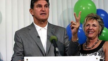 West Virginia Gov. Joe Manchin left, speaks as his wife, Gayle, stands by his side during a news conference at his campaign headquarters on Saturday, Aug. 28, 2010, in Charleston, W.Va. Manchin defeated Ken Hechler and Sheirl Fletcher in a special electio 