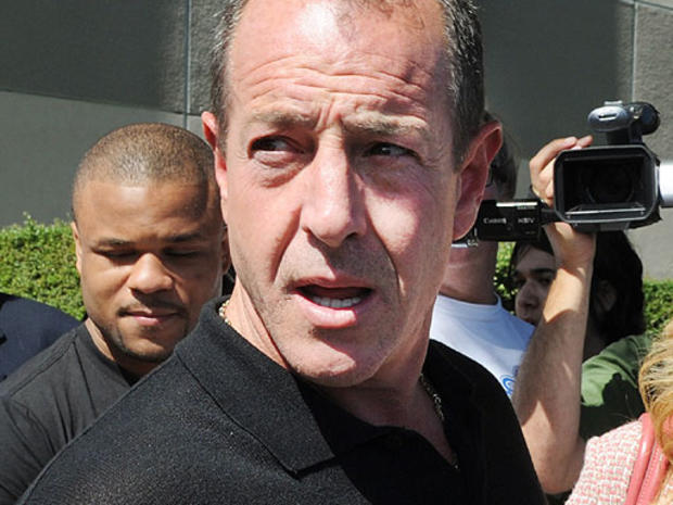 Michael Lohan, the father of Lindsay Lohan, leaves the building after she was sentenced to 90 days jail by Judge Marsha Revel during her hearing at the Beverly Hills Courthouse on July 6, 2010. 