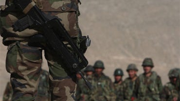 A French army instructor (L) addresses Afghan National Army (ANA) trainee officers during training with the French army within the framework of Epidote progamme at the Kabul Military Training Camp near the capital on January 13, 2010. 