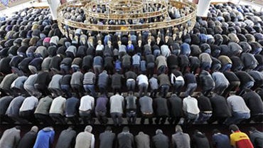 Muslims pray at a mosque for the Eid al-Fitr holiday, which marks the end of the holy Muslim fasting month of Ramadan in Duisburg, western Germany, Friday, Sept. 10, 2010. (AP Photo/Martin Meissner) 
