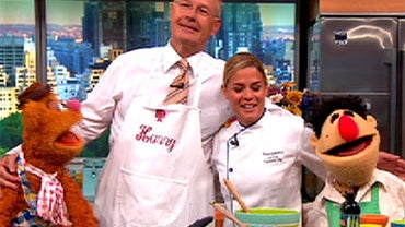 From left, Fozzie Bear, Harry Smith, Cat Cora and Angelo on "The Early Show." 