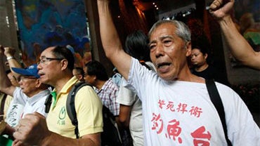 Hong Kong protesters shout slogan near the Japanese Consulate in Hong Kong Wednesday, Sept. 15, 2010 as they demonstrate on a ship collision near the Diaoyu islands (Senkaku islands) AP  