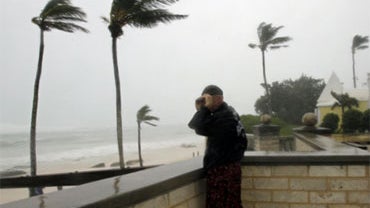 A man watches at Elbow Beach in Paget Parish as wind and rain  produced by Hurricane Igor moves onto Bermuda, Sunday, Sept. 19, 2010. 
