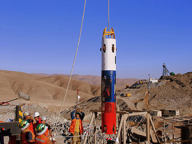 In this picture released by Chile's Presidency, workers test a capsule that will be used to rescue trapped miners from the collapsed San Jose mine in Copiapo, Chile, Thursday, Sept. 30, 2010. Thirty-three miners have been trapped deep underground in the c 