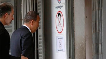 U.N. Secretary-General Ban Ki-moon, right, enters a room of the Tuol Sleng Genocide Museum, while touring the former Khmer Rouge regime's notorious S-21 prison in Phnom Penh, Cambodia, Oct. 28, 2010. (AP Photo/Heng Sinith) 