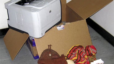 This undated photo released by the Dubai Police via the state Emirates News Agency (WAM) on Saturday, Oct. 30, 2010, reportedly shows a computer printer and other contents of a package found onboard a cargo plane coming from Yemen, in Dubai, United Arab E 