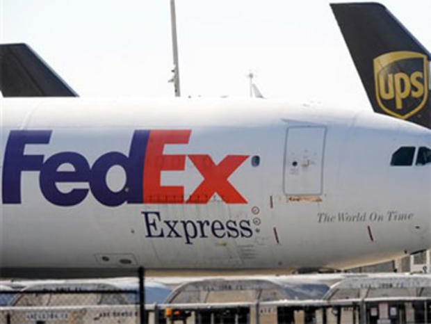 In this Oct. 30 2010 file photo, FedEx and UPS cargo planes sit on the tarmac of the north cargo terminal area at Hartsfield-Jackson Atlanta International Airport in Atlanta. The glaring weakness of the cargo shipping system has been laid bare by the Yeme 