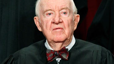 Associate Justice John Paul Stevens poses during a group photograph at the Supreme Court building on September 29, 2009 in Washington, DC. The high court made a new group photograph with its newest member Associate Justice Sonia Sotomayor. (Photo by Mark  