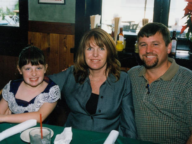 Amber Dubois with her mother, Carrie McGonigle, and the man she called her stepfather, Dave Cave. 