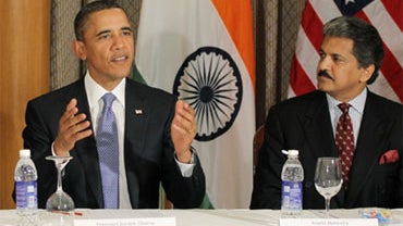U.S. President Barack Obama is seated with Anand Mahindra of Mahindra & Mahindra as he meets with entrepreneurs in Mumbai, India, Saturday, Nov. 6, 2010. 