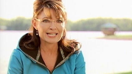 The fence between former Alaska Gov. Sarah Palin's lakeside home, rear, and the home being rented by author Joe McGinniss is seen Thursday, May 27, 2010, in Wasilla, Alaska. 