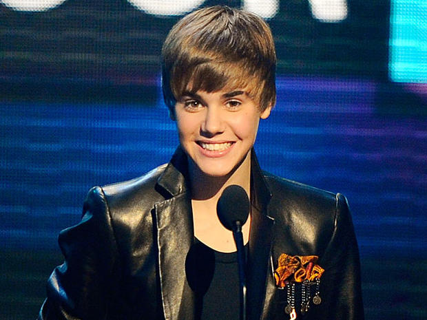 Justin Bieber accepts the award for pop/rock favorite male artist at the 38th Annual American Music Awards on Sunday, Nov. 21, 2010, in Los Angeles. 