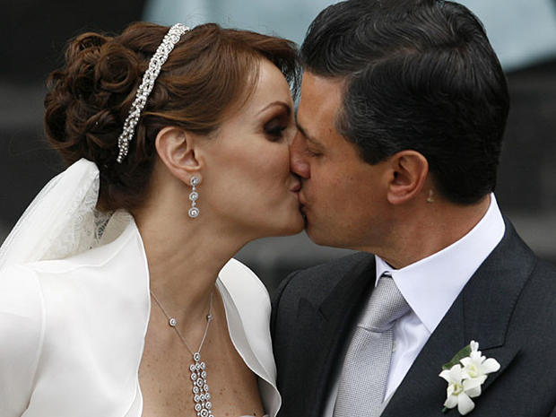 Mexican actress Angelica Rivera, right, kisses her new husband,  Pe 