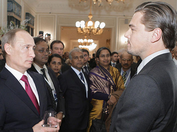 this Tuesday, Nov. 23, 2010 photo Russian Prime Minister Vladimir Putin speaks to US actor Leonardo Di Caprio, right, after a concert dedicated to tiger conservation in St. Petersburg, Russia. Officials from the 13 countries where tigers live in the wild  