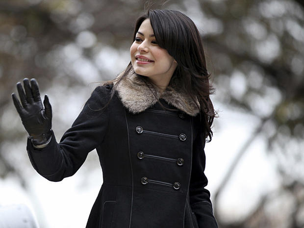 Actress and singer Miranda Cosgrove waves as she rides by on a float during the Macy's Thanksgiving Day Parade in New York Thursday, Nov. 25, 2010. (AP Photo/Craig Ruttle) ________________________________________ 
