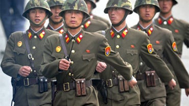 North Korean soldiers march on the north side of the truce village of Panmunjom in the demilitarized zone separating the two Koreas, north of Seoul September 29, 2010. The Worker's Party of Korea on September 28 held its highest-level gathering for 30 yea 