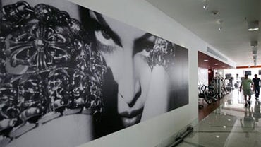 A photograph of Madonna hangs in Hard Candy Fitness before its opening in Mexico City, Sunday Nov. 28, 2010. (AP Photo/Miguel Tovar) 