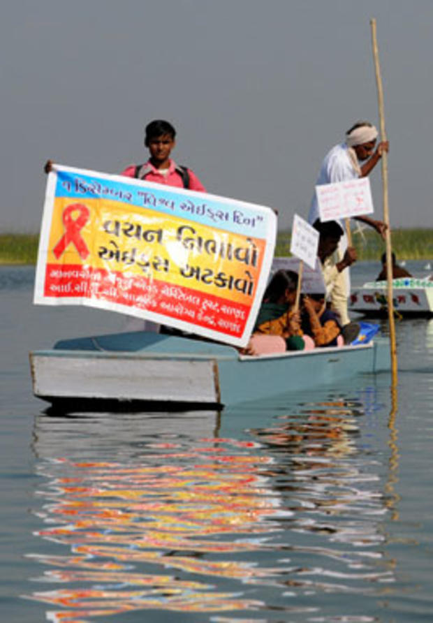 Indian nursing staff from the Ahmedabad Civil Hospital and citizens participate in a boat rally at Nalsarovar, some 60 kms from Ahmedabad on December 1, 2010, to mark World Aids Day. The event was organised by the Manav Sewa Education and Charitable Trust 