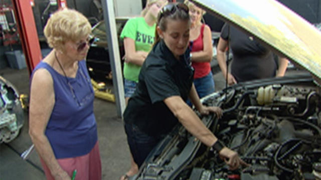 Auto mechanic Sarah "Bogi" Lateiner (center) teaches basic car maintenance classes to women.   