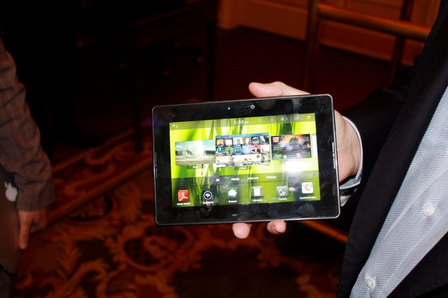Research in Motion co-CEO Mike Lazaridis shows off the Playbook tablet on the sidelines of the D: Dive Into Mobile conference. 