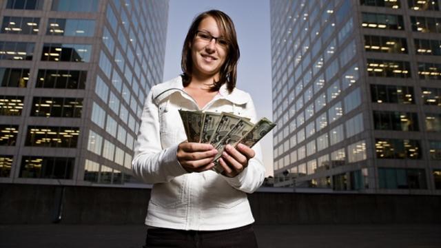 girl_with_money_tipping.jpg 