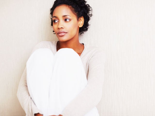 pensive woman of color