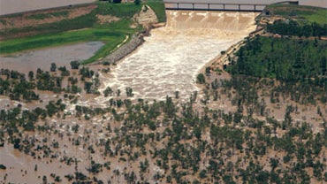 This aerial photo taken on December 31, 2010 shows the Fairbairn Dam spilling into the Queensland town of Emerald, illustrating the extent of flooding across the area. 
